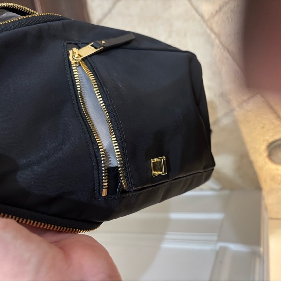 TUMI crossbody sling travel bag Great condition Black gold trim no odors/ tears - Picture 9 of 13